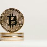 Golden Bitcoin displayed prominently on a white background showcasing cryptocurrency value.